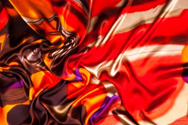 Kumaş renk soyutlama, bir desenle sarı, kırmızı. Fotoğraf stüdyosu