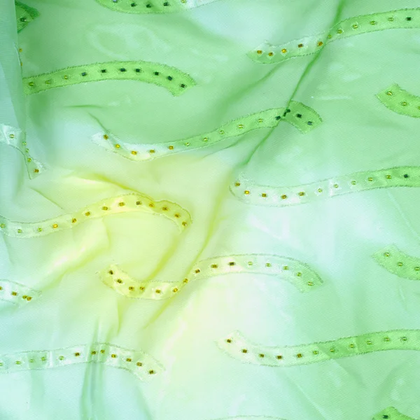 Tekstur kain sutra, latar belakang. warna hijau dan kuning — Stok Foto