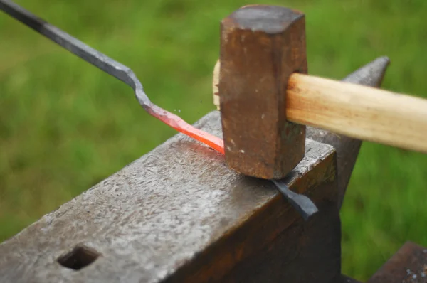 blacksmith, smith, farrier, hammersmith, forger, smithy. treat (metal) by heating, hammering, and forging it.