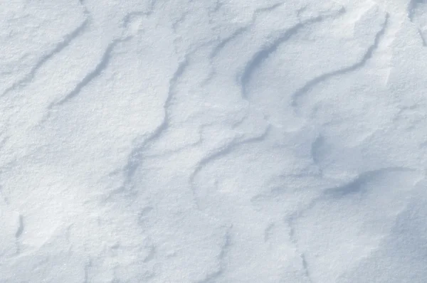 雪のテクスチャです 大気中の水蒸気が凍って氷の結晶と光の白いフレークで落下や白い層として地面に横たわってに — ストック写真