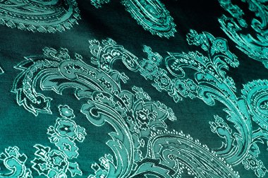 Kumaş renkleri yeşil, desenli. Fotoğraf stüdyosu