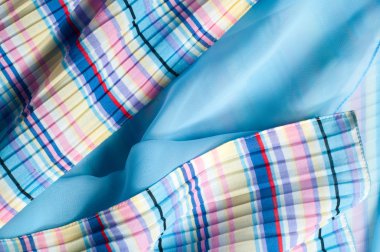 Pileli kumaş. Sinii sarı kırmızı beyaz çizgili doku. Fotoğraf stüdyosu