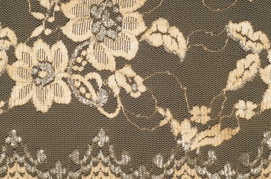 Doku. Stud oyununda yapılan dantel kumaş altın sarı renkli fotoğraflar