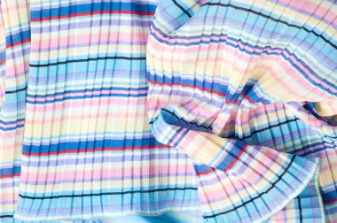 Pileli kumaş. Sinii sarı kırmızı beyaz çizgili doku