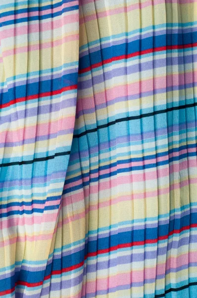 Плісе з тканини. Сині жовті червоні білі смуги текстури — стокове фото