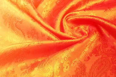 Kumaş ipek doku altın rengi, kırmızı ve sarı desen