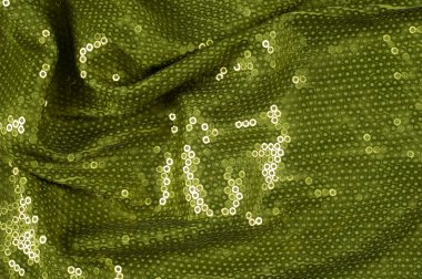 Fabric texture with green sequins clipart