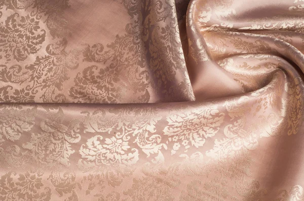 A textura do tecido de seda de bege com pequeno padrão branco — Fotografia de Stock