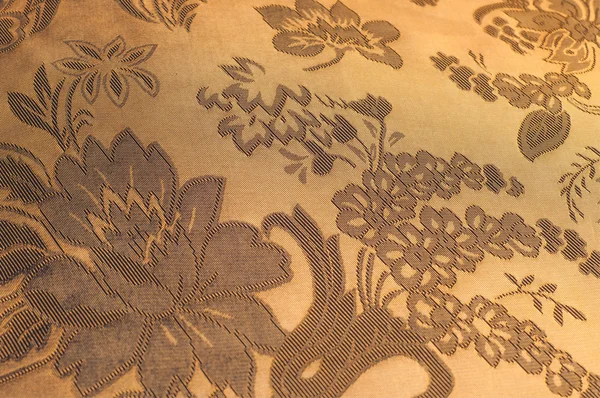 生地シルクのテクスチャー カラー砂茶色。ファブリに不織布 — ストック写真