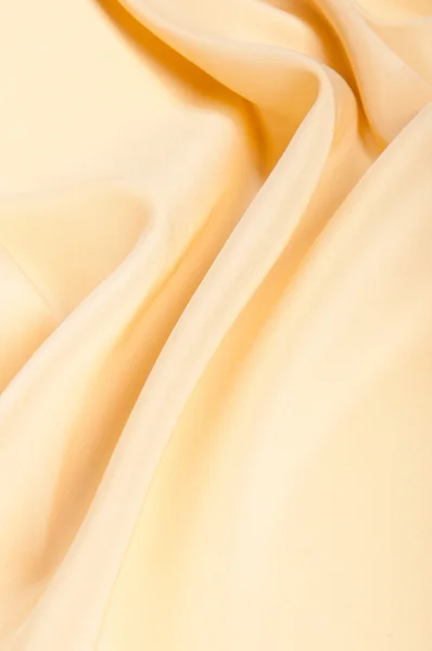 Текстура атласной ткани. бежевый цвет . — стоковое фото