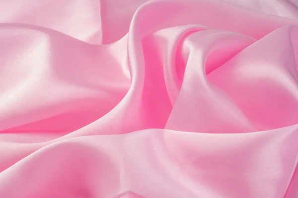 Ткань шелковая текстура розовая — стоковое фото
