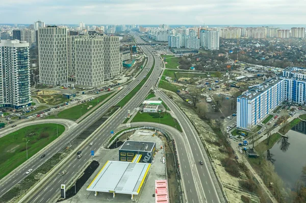 Kiev, Ukraine - January 02, 2021, aerial photography from a drone, bird\'s-eye view, of the Poznyakovsky district with the modern buildings of the city.