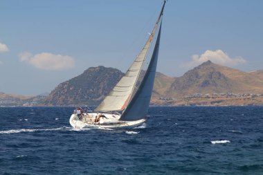 Bodrum,Turkey. 24 May 2019: Sailboats sail in windy weather in the blue waters of the Aegean Sea, on the shores of the famous holiday destination Bodrum.