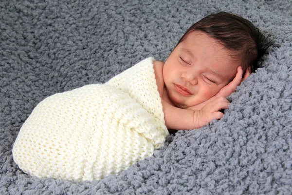 Newborn girl on grey blanket — Stock Photo, Image