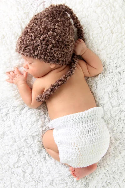 Newborn baby wearing a knitted hat — Stock Photo, Image