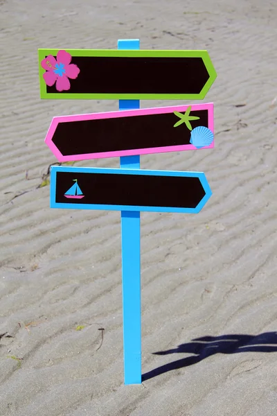 Sign post on a beach. — Stock Photo, Image