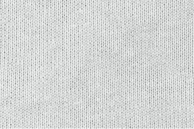 Örgü yün kumaş arka planının beyaz doğal dokusu. Beyaz pamuk kumaş, örülmüş tuval dokusu