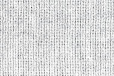 Örgü yün kumaş arka planının beyaz doğal dokusu. Beyaz örgü, pamuk kumaş, dokuma bezi dokusu. Kapat.