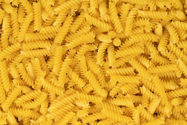 Raw Spiral Pasta Background Texture — Stock Photo, Image