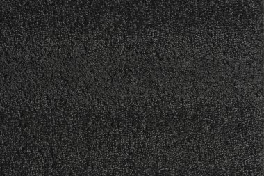 Siyah köpük plastik arka plan dokusu. Tasarımcılar için siyah arkaplan. koyu renk köpük.