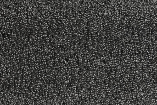 Black foam plastic background texture. black background for designers. dark styrofoam