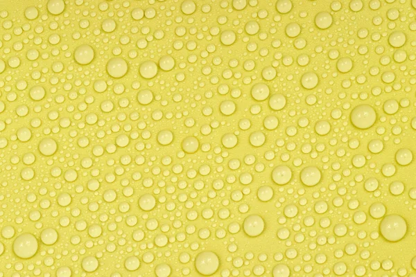 Water Drops Yellow Background Texture Backdrop Glass Covered Drops Water — Stock Photo, Image