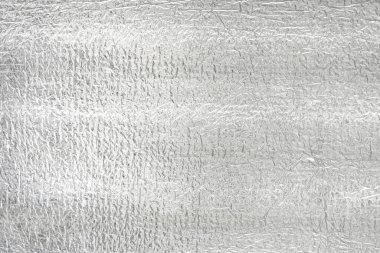 Gümüş folyonun kusursuz arka plan dokusu. Parlak beyaz bir yüzey. yansıtıcı