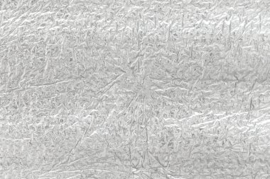 Gümüş folyonun kusursuz arka plan dokusu. Parlak beyaz bir yüzey. yansıtıcı