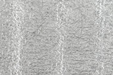 Gümüş folyonun kusursuz arka plan dokusu. Parlak beyaz bir yüzey. yansıtıcı