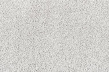 Beyaz kıvırcık yün dikişsiz doku arka planı. kısa fabrika malzemesi ile doku.