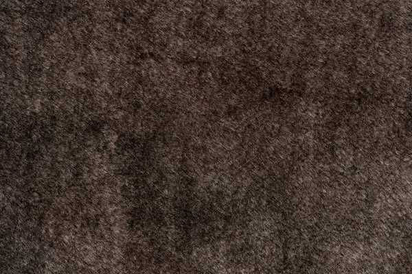 Brown factory material with pile and wool background texture. fur coat texture. sofa texture