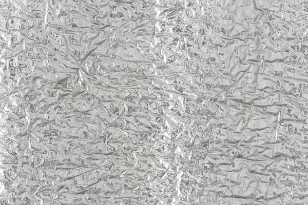 Gümüş folyonun kusursuz arka plan dokusu. Parlak beyaz bir yüzey. yansıtıcı