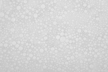 Su arka planında küçük sabun köpüklerinin dokusu. köpük