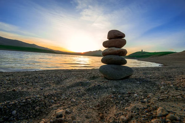 Stones in balance at the sunset backgroun