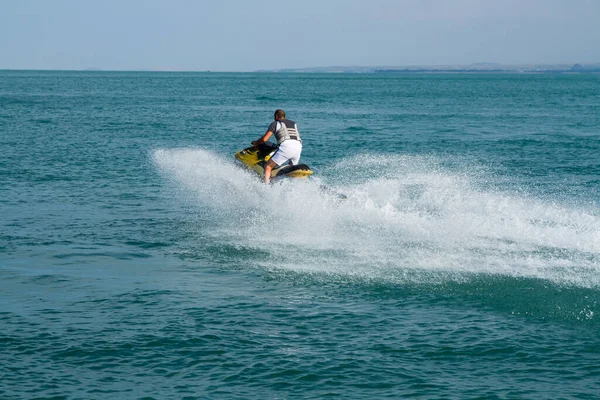 young people on a water scoote