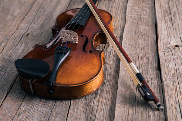 classical violin on wooden table. music backgroun