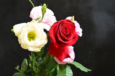 bouquet of rose and eustoma flowers, close - up 
