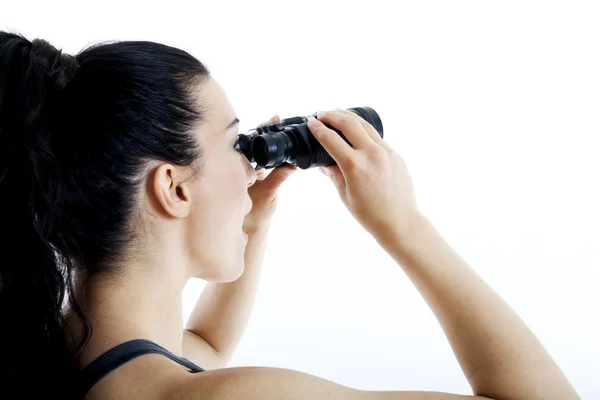 Bela mulher procurando com binóculos — Fotografia de Stock