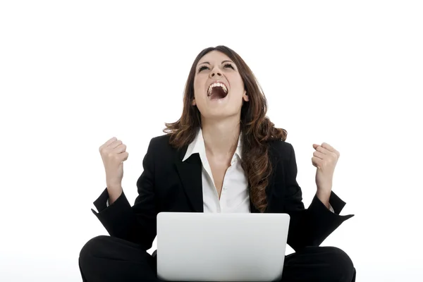 Excited woman with arms up winning online Royalty Free Stock Images