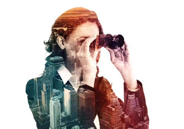 Double exposure of businesswoman with binocular and megalopolis Royalty Free Stock Photos