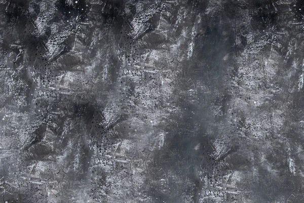 A fal texturált, egyenetlen felülete sötétszürke kőből — Stock Fotó