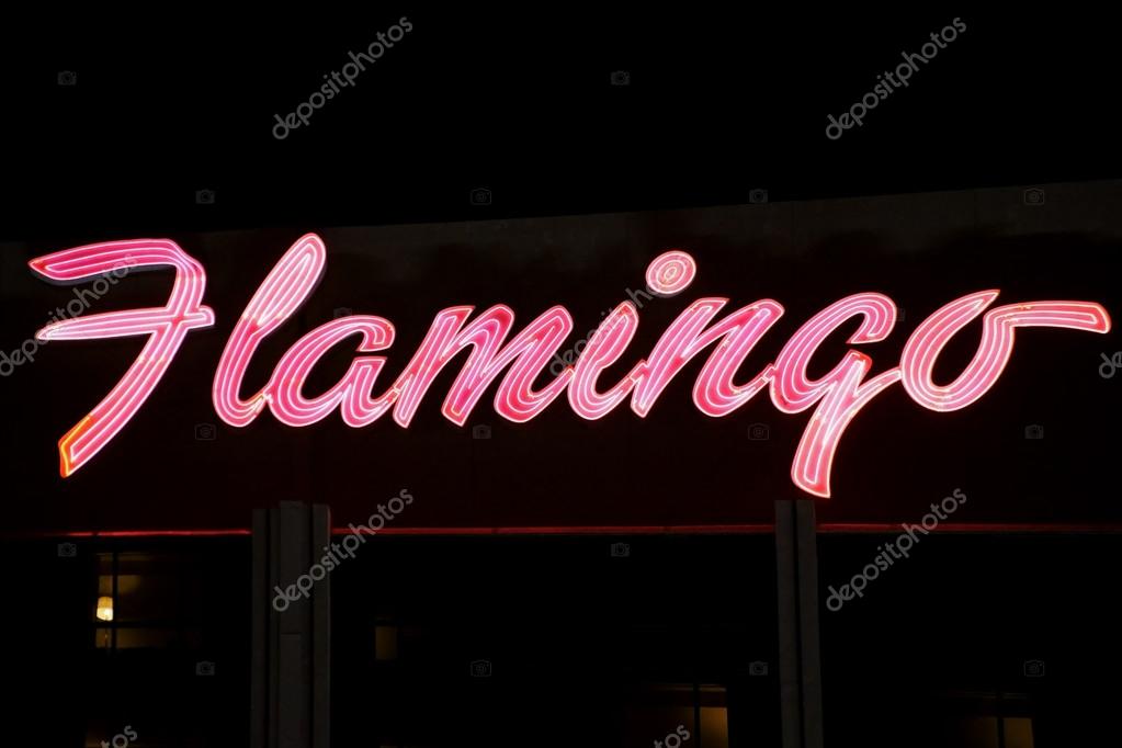 The neon-lit lettering and pink logo of the luxury hotel and casino Flamingo on the night of December 23, 2015 in Las Vegas.