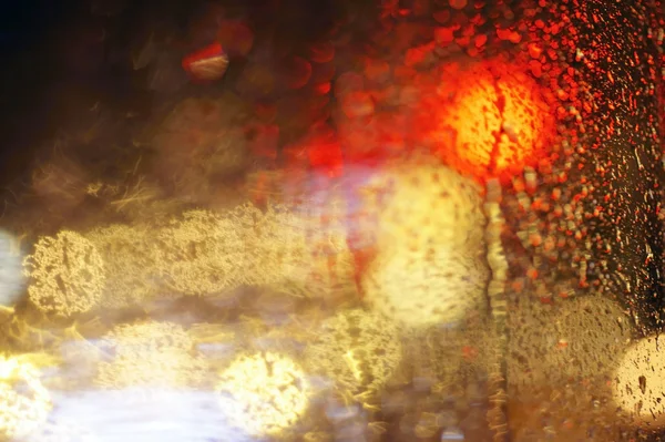 Lights behind the rainy window — Stock Photo, Image