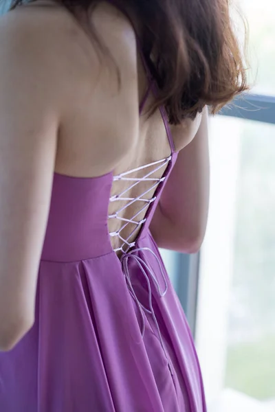 woman in a lilac dress