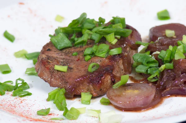 Grilled pork steak on white plate. — Stock Photo, Image