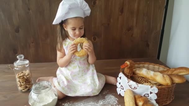 Three Year Old Girl White Dress Baking Cap Eating Big — Stock Video