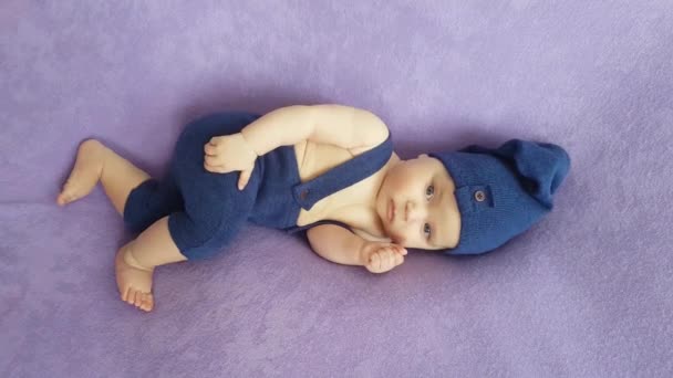 Five Month Old Boy Blue Gnome Costume Lies Purple Bedspread — Stock Video