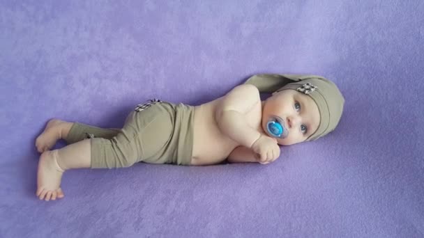 Five Month Old Boy Beige Gnome Suit Naked Torso Pacifier — Stock Video