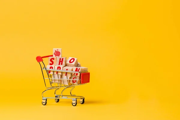 Cart Filled Wooden Cubes Inscription Shopping Yellow Background Copy Space — 图库照片