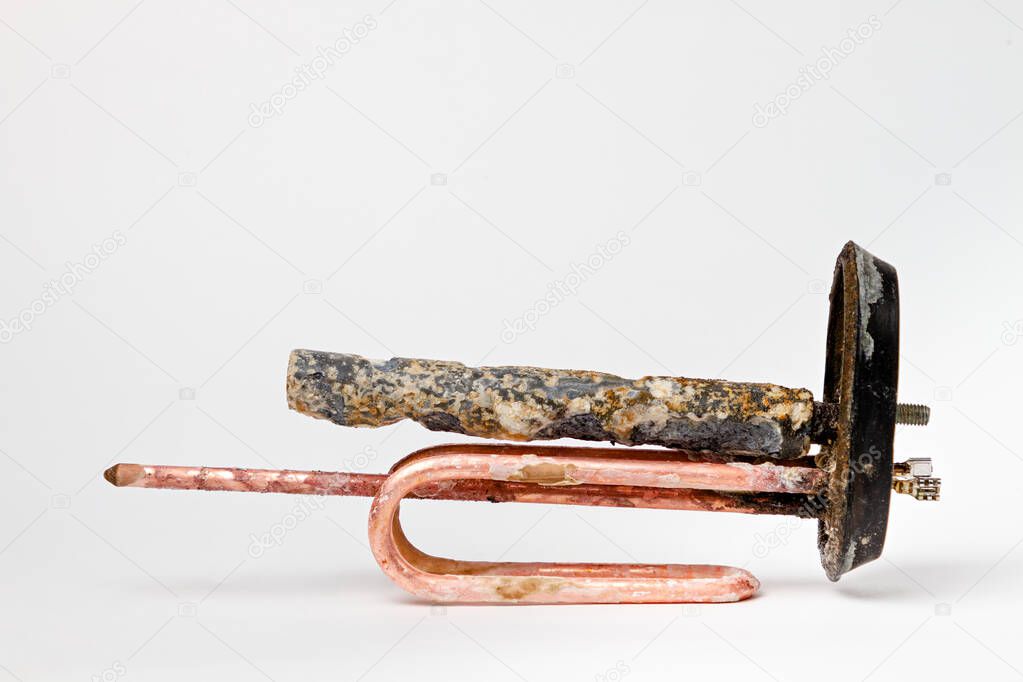 Clean heating element for heating water in domestic water heaters and boilers on white background. Copy space.